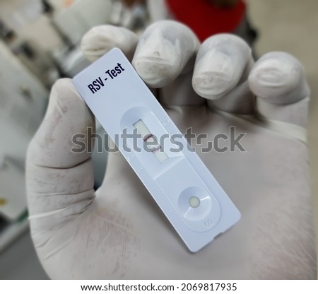 Rapid screening test for RSV (Respiratory syncytial virus) with positive result. Rapid test cassette Royalty-Free Stock Photo #2069817935