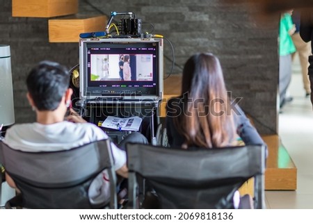 Monitors and modern shooting equipment. Film crew, lighting devices, monitors, playbacks. Monitor for Director works with a group or plays while filming.
