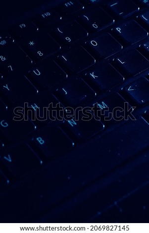 black computer keyboard background, with dark photo concept.