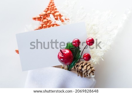 A blank text card lies with new decorations on a white background