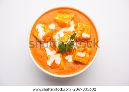 Paneer Butter Masala or Cheese Cottage Curry served with rice and laccha paratha Royalty-Free Stock Photo #2069835602