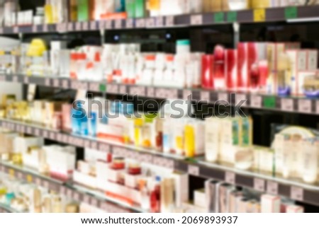 Products on shelves at cosmetics store blurred and defocused store photography at Shopping mall of department store