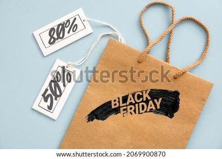 	
 label Sale tag with shopper paperbag, black Friday or cyber monday shopper - online shopping concept