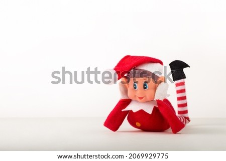 Christmas Elf toy on a white background with copy space. Christmas spirit, Christmas tradition.