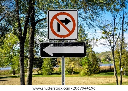 No right turn, go left turn signs