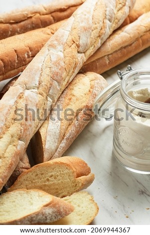 French Soft Baguette Bread on Marble Table, Selected Focus. Concept White Bakery