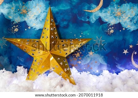 Christmas background with moon and stars. Defocused, bokeh, abstract backdrop.