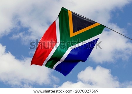 South Africa flag isolated on sky background. close up waving flag of South Africa. flag symbols of South African.