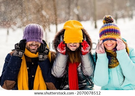 Photo of cheerful family happy positive smile have fun playful fooling close cover eyes hat outdoors