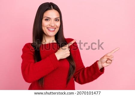 Photo of impressed brunette lady point empty space wear red pullover isolated on pink color background