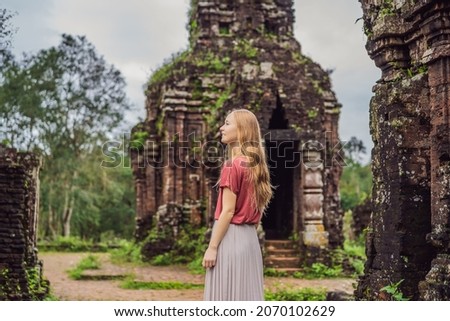 Woman tourist in Temple ruin of the My Son complex, Vietnam. Vietnam opens to tourists again after quarantine Coronovirus COVID 19 Royalty-Free Stock Photo #2070102629