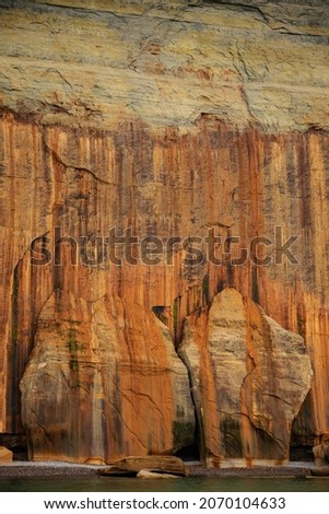 Abstract landscape of a mineral stained cliff along the eroded sandstone shoreline of Lake Superior, Pictured Rocks National Lakeshore, Michigan’s Upper Peninsula, USA