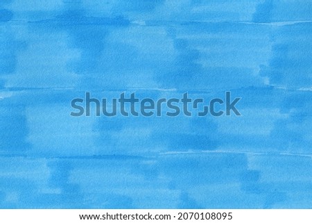 closeup macro of permanent blue marker doodles brushes on white background paper with visible surface fiber structure details  Royalty-Free Stock Photo #2070108095