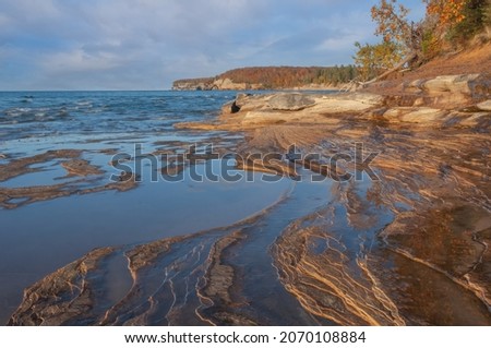 Autumn landscape of the sandstone shoreline of Lake Superior at Pictured Rocks National Lakeshore, Michigan's Upper Peninsula, USA