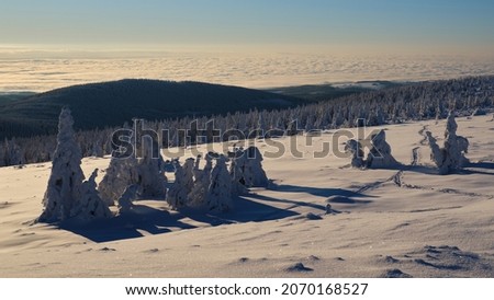 Mountain ridge in winter with a view to the lowlands, Jeseniky, Czech Republic.