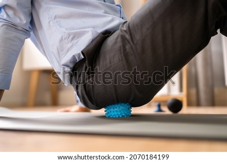 Glutes Trigger Point Massage Using Spiky Ball Myofascial Release Royalty-Free Stock Photo #2070184199
