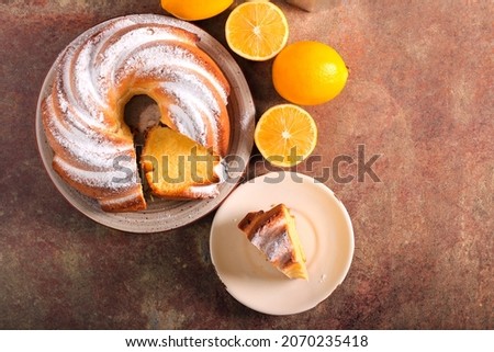 Lemon and sour cream ring cake, with icing sugar on top