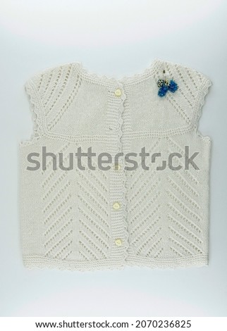 Stylish knitted wool sweater on white background. Children's wool sweater models.