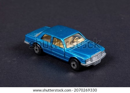 Blue toy hobby car decorative object on black background different perspective Angles buy abstract pastel interesting different background image