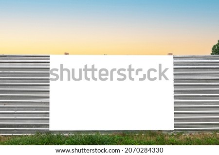 Blank white banner for advertisement on the fence of construction area