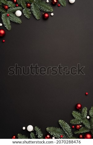 Christmas template for design with festive frame with candy cane and Christmas balls on black background