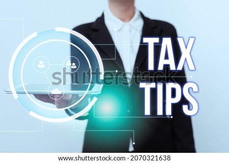 Writing displaying text Tax Tips. Business approach compulsory contribution to state revenue levied by government Woman In Uniform Displaying Mobile Device Futuristic Virtual Tech.