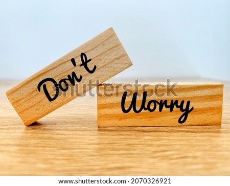 Don't worry text on image of wooden bricks