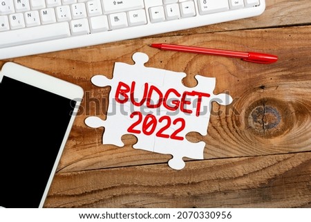Conceptual display Budget 2022. Business showcase estimate of income and expenditure for current year Building An Unfinished White Jigsaw Pattern Puzzle With Missing Last Piece