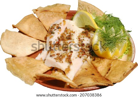 Mexican food with honey served in traditional plate with tortillas
