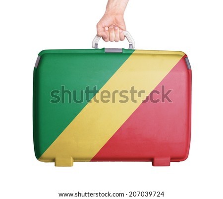 Used plastic suitcase with stains and scratches, printed with flag, Congo
