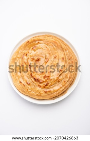 Laccha Paratha is a layered Puffed Flatbread with lots of ghee or oil Royalty-Free Stock Photo #2070426863