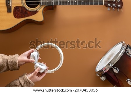 Musical background with musical instruments, flat lay, music creation concept.