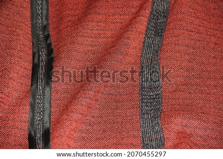 Bright orange woolen fabric with gray stripes. Backgrounds