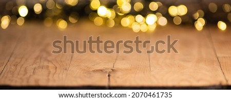 empty wooden table top with blurred light gold bokeh abstract background. For montage product display or design key visual layout