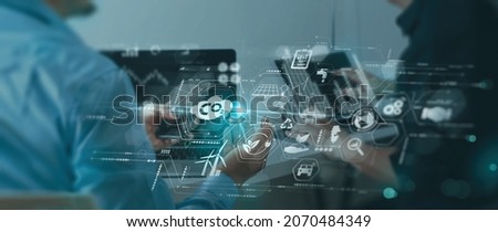 Businessman wit team working virtual modern smart phone to reduce CO2 emissions carbon footprint climate change to limit global warming.Sustainable development and green business concept. Royalty-Free Stock Photo #2070484349
