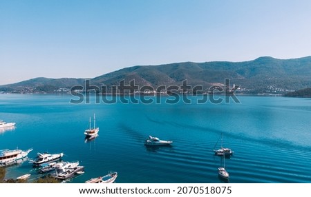 Natural background. A sea bay with yachts in the Aegean Sea, a view from a height.