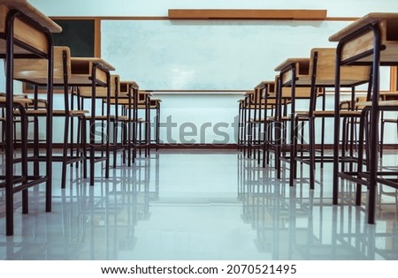 School interior of empty class room with board and seat when nobody or no student in classroom situation of Covid-19 disease outbreak and have to learning of distance teaching during COVID-19