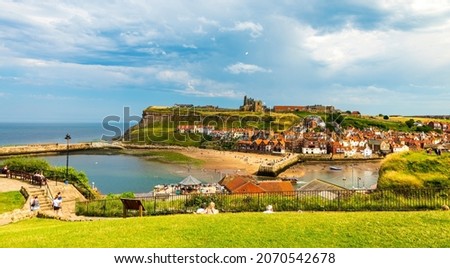 Sunshine on Whitby town, harbour and abbey Royalty-Free Stock Photo #2070542678