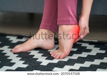 Plantar fasciitis, heel spur, foot pain, man suffering from feet ache at home, podiatry concept Royalty-Free Stock Photo #2070547508