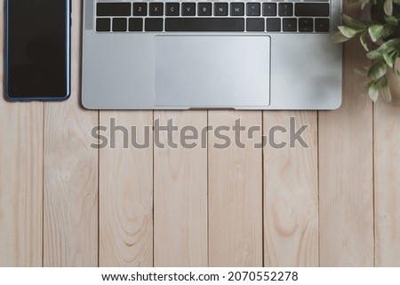 Workspace background, Modern business money and financial space for text. layout banner in website. Laptop and office equipment on wood desk. top view, flat lay, free copy.