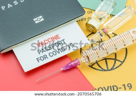 International certificate of COVID-19 coronavirus vaccination, a record proving a traveler has received certain vaccines. A document attesting that its bearer is immune to a contagious severe disease. Royalty-Free Stock Photo #2070565706