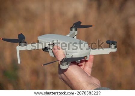 Quadcopter before flight in the hand of a man
