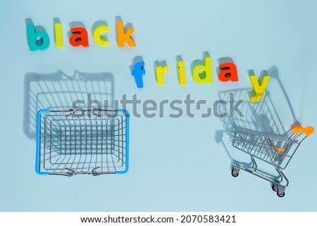 Inscription black Friday blue background low prices, discounts, shopping on Black Friday. Flat lay