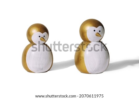 Christmas penguins golden color isolated