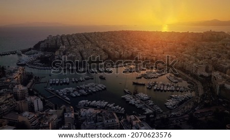 Aerial drone photo of iconic round port and marina  of Zea or Passalimani a safe yacht anchorage at sunset with beautiful colours, Piraeus, Attica, Greece