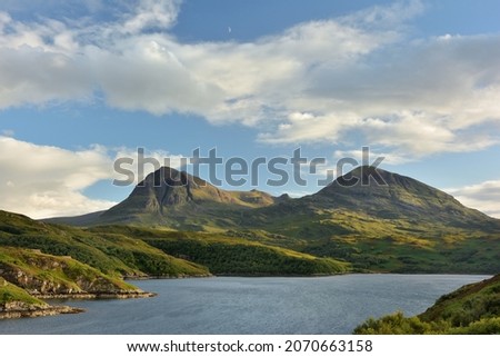 Sail Gharbh and Sail Ghorm corbetts from Kylesku viewpoint. Quinag mountain from the North Coast 500 route in the Scottish Highlands Royalty-Free Stock Photo #2070663158
