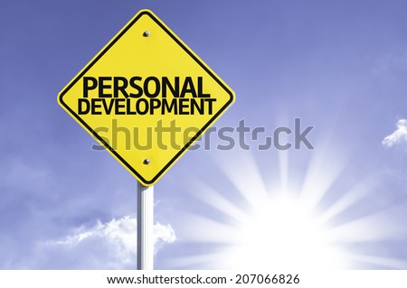 Personal Development road sign with sun background  Royalty-Free Stock Photo #207066826