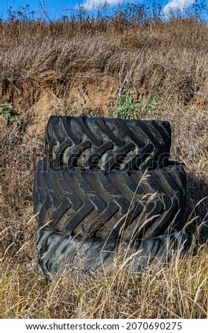 old rubber tires stacked on top of each other. High quality photo