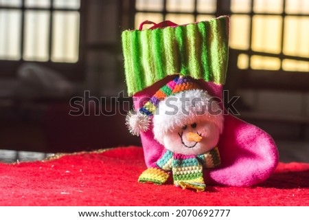 christmas concept with santa claus , angel , ornaments and plush , copy space and selective focus , dark background