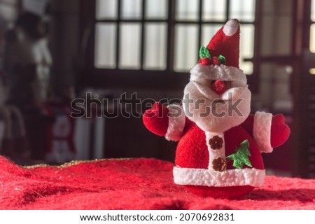 christmas concept with santa claus , angel , ornaments and plush , copy space and selective focus , dark background